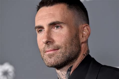 adam levine new face tattoo.